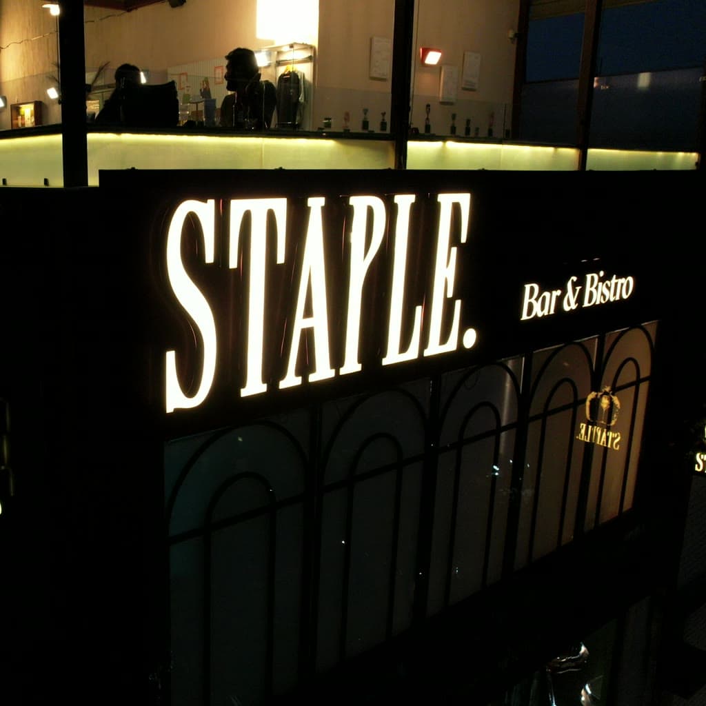 The same rooftop lounge lit up at night.