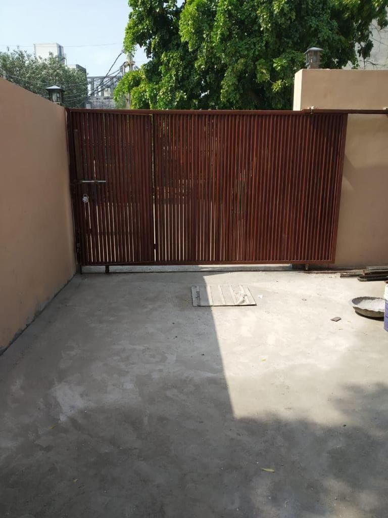 The entrance gate of E-43/7, Okhla, seen from inside the compound.